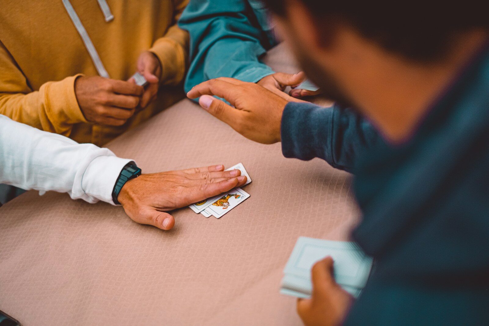 People playing cards at a table